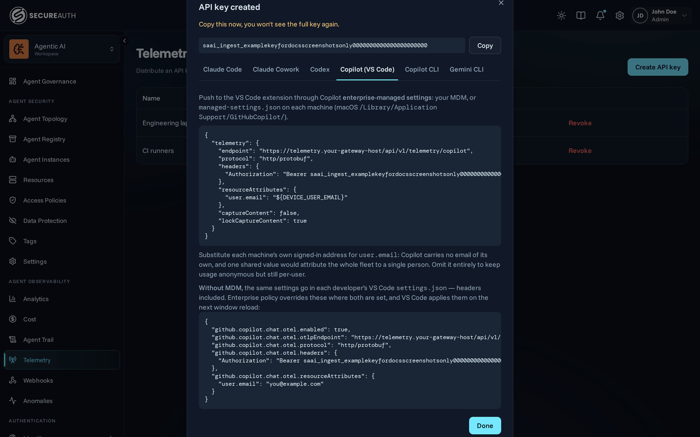 Ingest key dialog with the Copilot tab selected, showing the managed-settings telemetry block