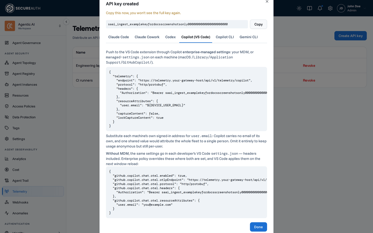 Ingest key dialog with the Copilot tab selected, showing the managed-settings telemetry block